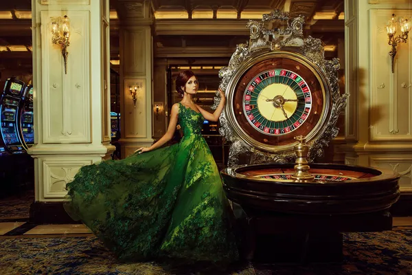 A close-up shot of golden coins falling around a spinning roulette wheel, representing immersive casino action at 8777BEF.